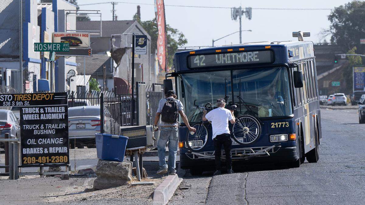 A man loads a bicycle onto a StanRTA bus on South Ninth Street in Modesto, Thursday, Oct. 17, 2024.