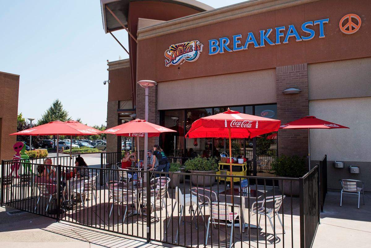 Patio seating at Squeeze In in Modesto, August 11, 2017.