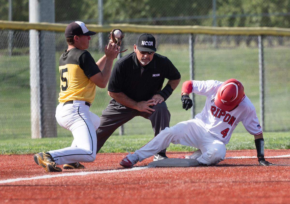 Ripon’s Korbin Hodgson beats the throw to Hughson third baseman Ethan Jones for a triple during the Trans Valley League game at Mistlin Park in Ripon, Calif., on Wednesday, April 27, 2022. Ripon won the game 11-1.