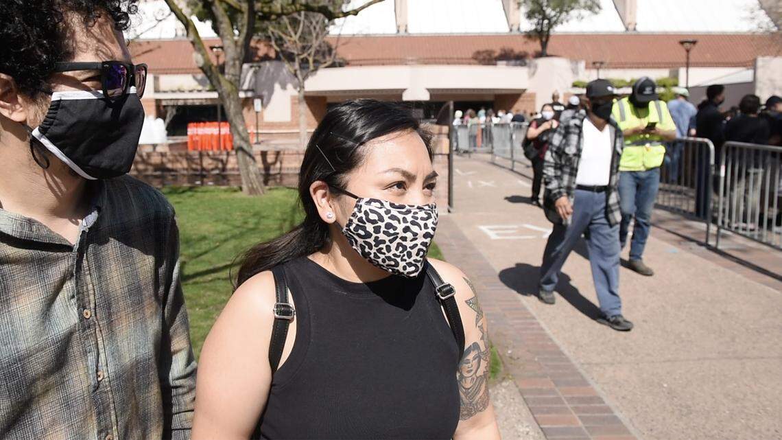Carla Noguera, 34, and Adolfo Noguera, 31, both were vaccinated at the COVID-19 vaccination clinic at Modesto Centre Plaza in Modesto, Calif., on Thursday, April 1, 2021.
