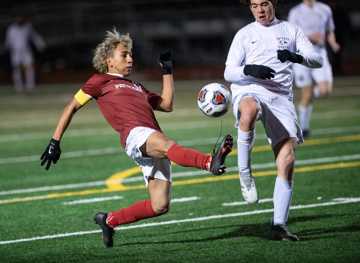 Patterson Johan Mendoza controls the ball as Vista del Lago’s William Wong defends in the Sac-Joaquin Section Division III title game at Turlock High School in Turlock, Calif., on Tuesday, Feb. 22, 2022. Vista del Lago won the championship 2-0.