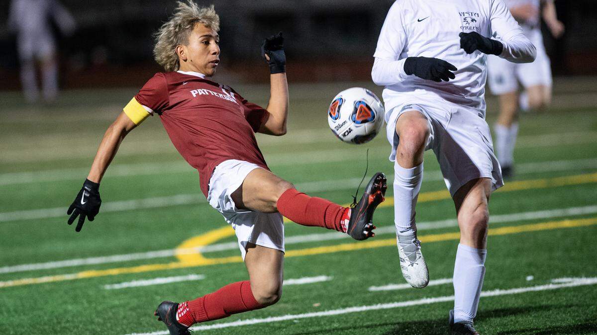 Patterson Johan Mendoza controls the ball as Vista del Lago’s William Wong defends in the Sac-Joaquin Section Division III title game at Turlock High School in Turlock, Calif., on Tuesday, Feb. 22, 2022. Vista del Lago won the championship 2-0.