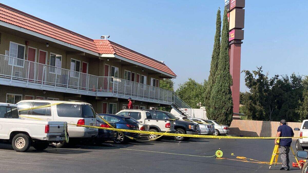 Police investigate the scene of a fatal shooting at the Days Inn in Turlock, Calif. Monday Sept. 7, 2020.