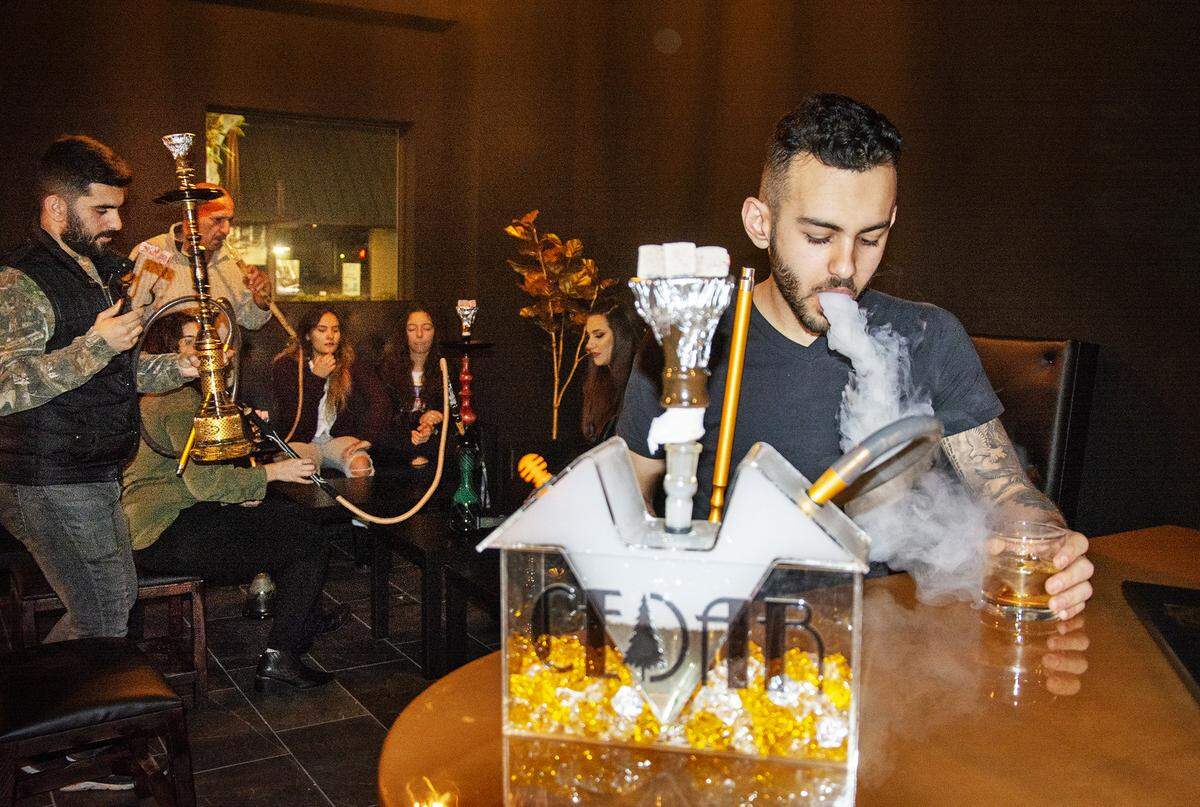 Brolin Davidoff smoked a hookah at the new Cedar Bar & Lounge in downtown Modesto, Calif. Jan. 15, 2020.
