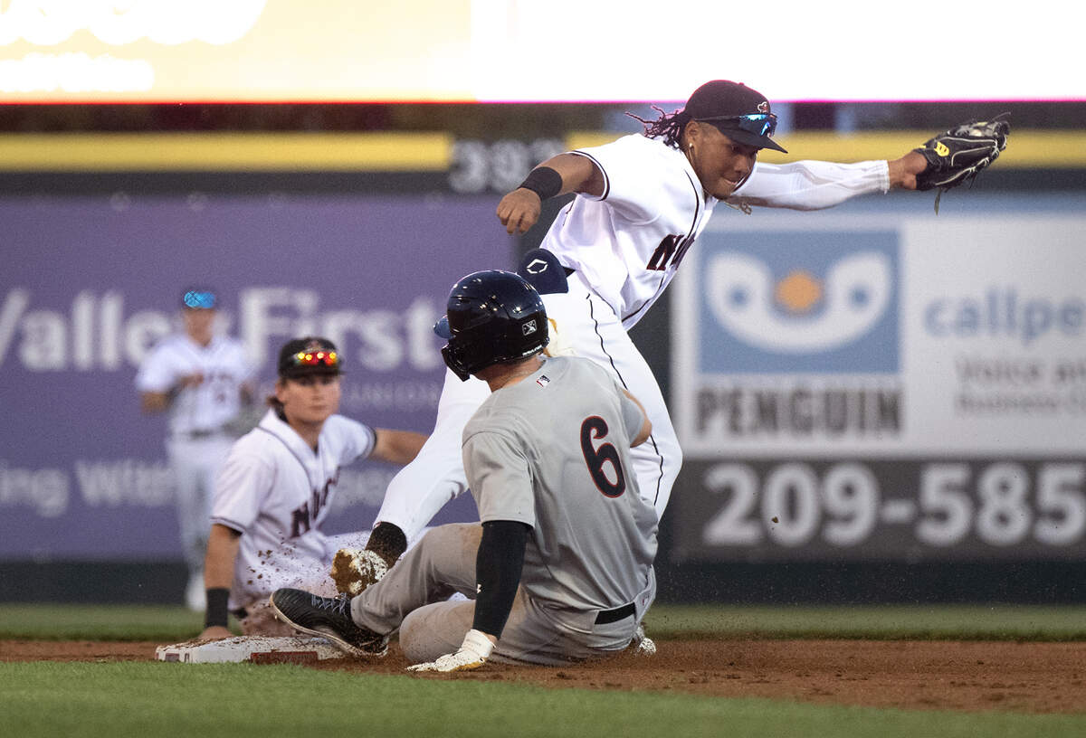 Modesto Nuts second baseman Michael Arroyo forces out Lake Elsinore’s Ryan Wilson on a feed from shortstop Colt Emerson during the season home opener at John Thurman Field in Modesto, Calif., Tuesday, April 9, 2024.