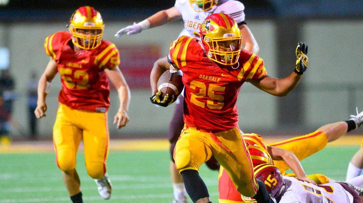Oakdale running back Zeke Saffar sprints upfield during a game between Oakdale High School and Liberty High School at Oakdale High School in Oakdale California on August 30, 2019.