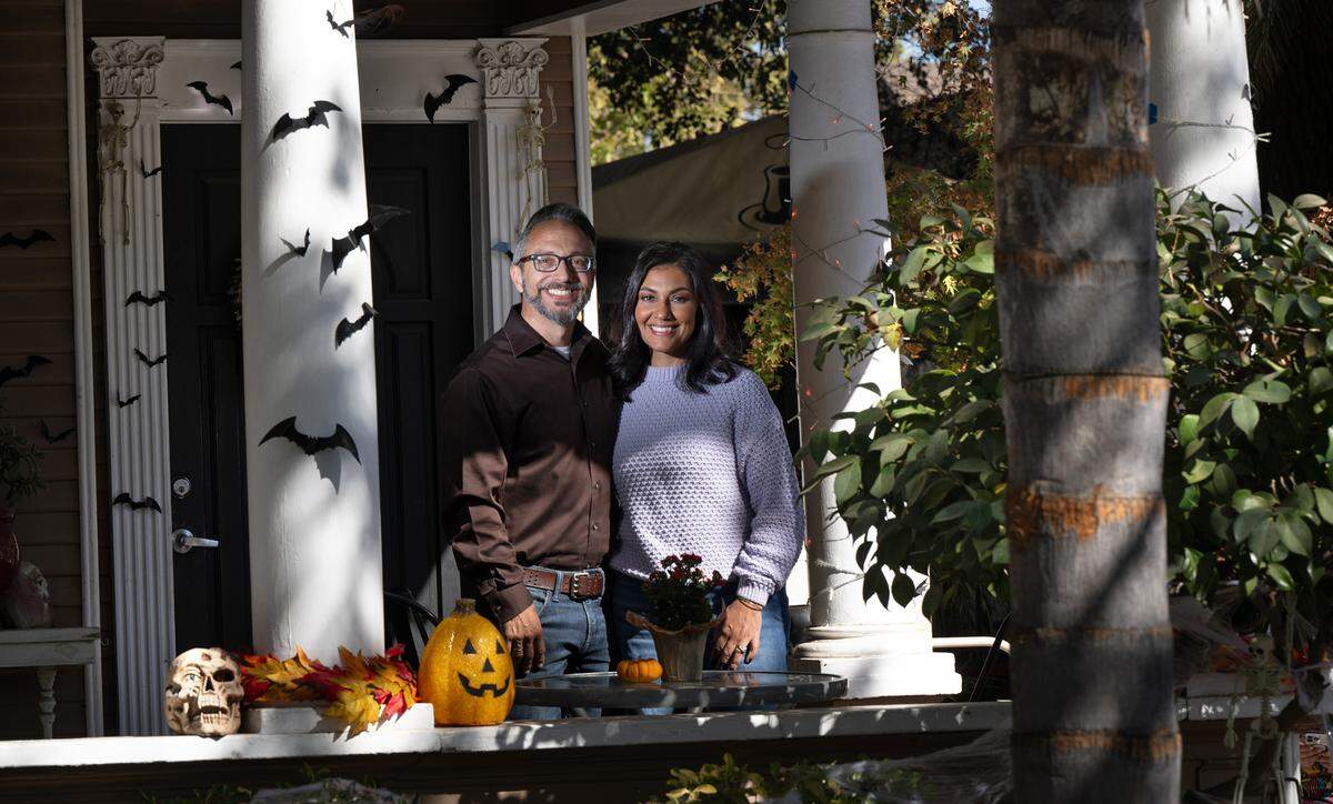 Owners Ruhi Sheikh and Sam Pierstorff on the porch at Queen Bean Coffee & Social House in Modesto, Tuesday, Oct. 22, 2024.