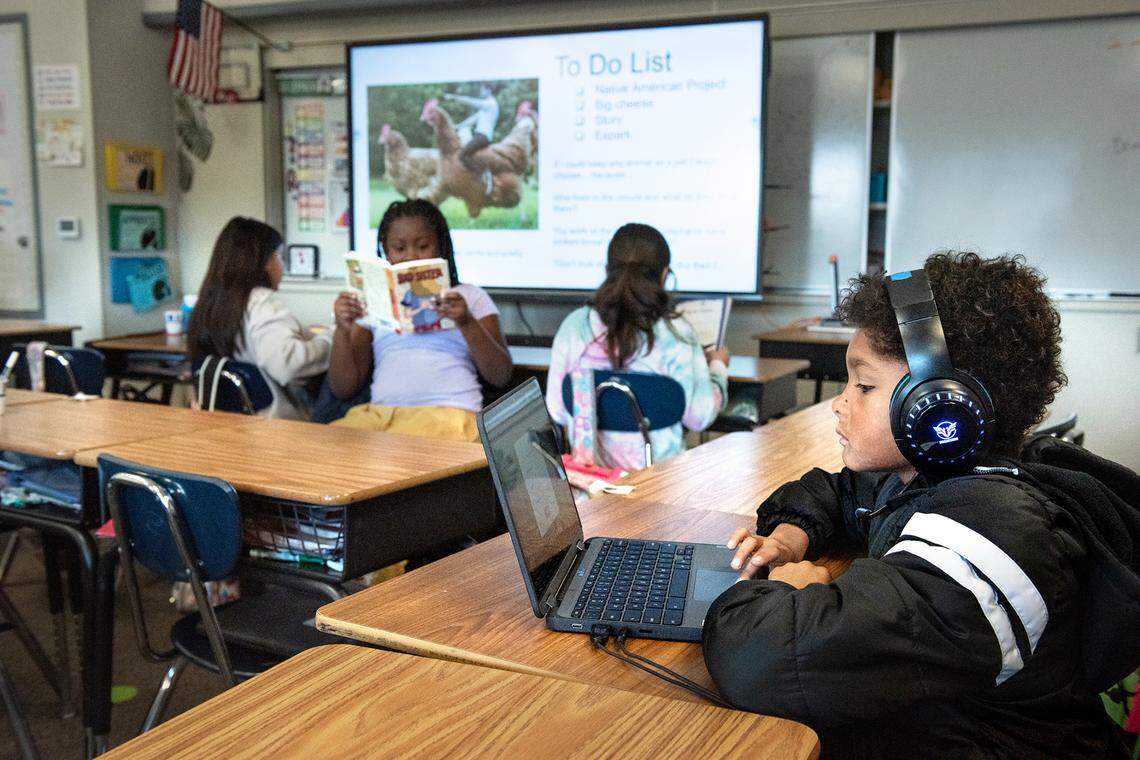 Fourth grade students, including Jackson Jett, right, work on independent reading during class at Walter White Elementary School in Ceres, Calif., Wednesday, Dec. 14, 2022.