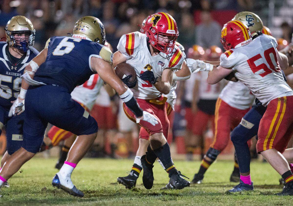 Oakdale’s Jace Rau runs the ball during the Valley Oak League game with Central Catholic in Modesto, Calif., Friday, Oct. 14, 2022.