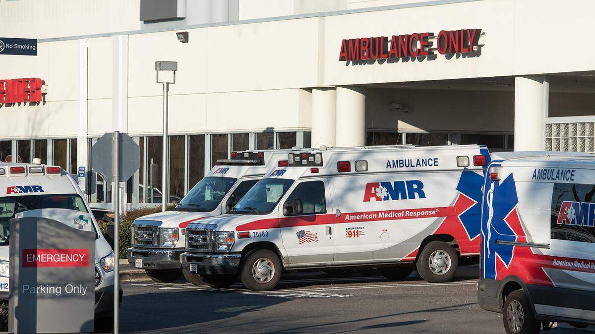 AMR ambulances are parked outside the emergency department at Sutter Memorial Medical Center in Modesto, Calif., on Tuesday, Jan. 25, 2022.