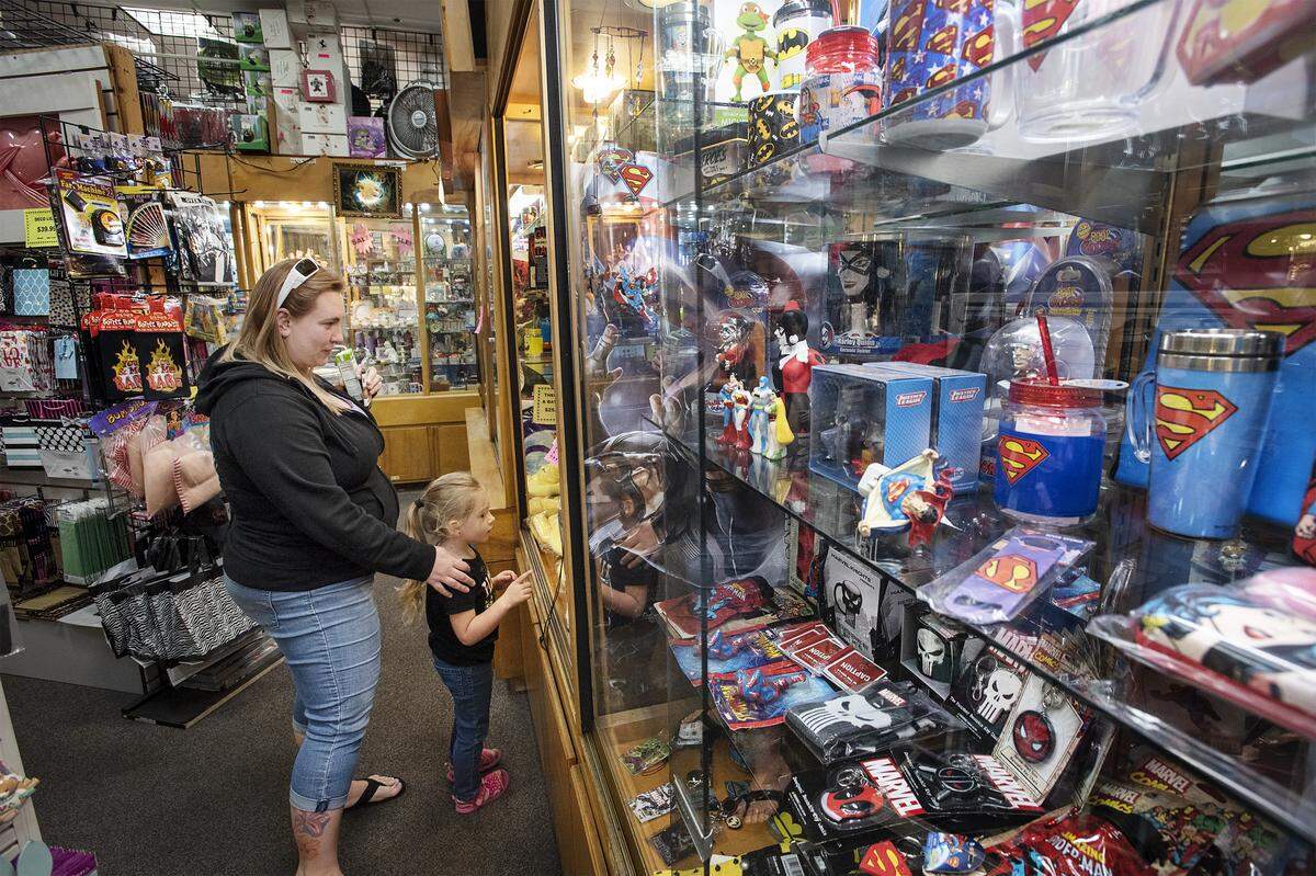 Stephonye Harris and her daughter Harmonye, 4, shops at International Imports at Vintage Faire Mall in Modesto, Calif., on Friday, Feb. 21, 2020.