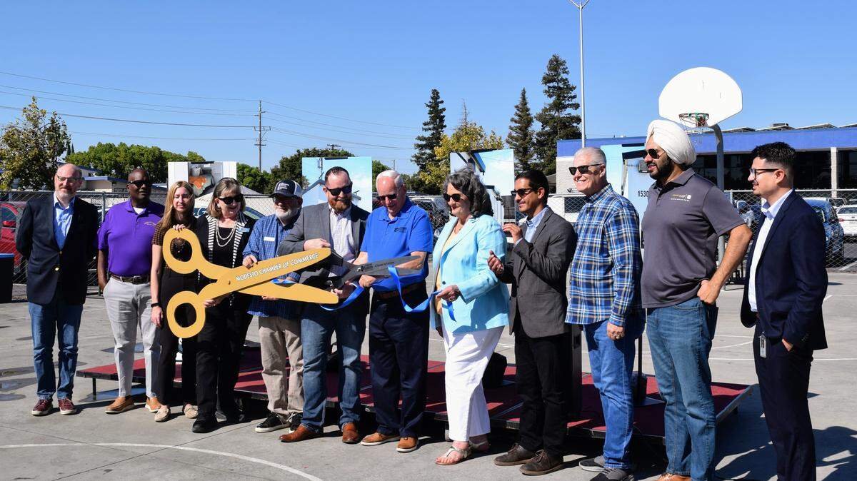 Local leaders and community members cut the ribbon to commemorate the opening of Grace Gardens on Aug. 15, 2025.