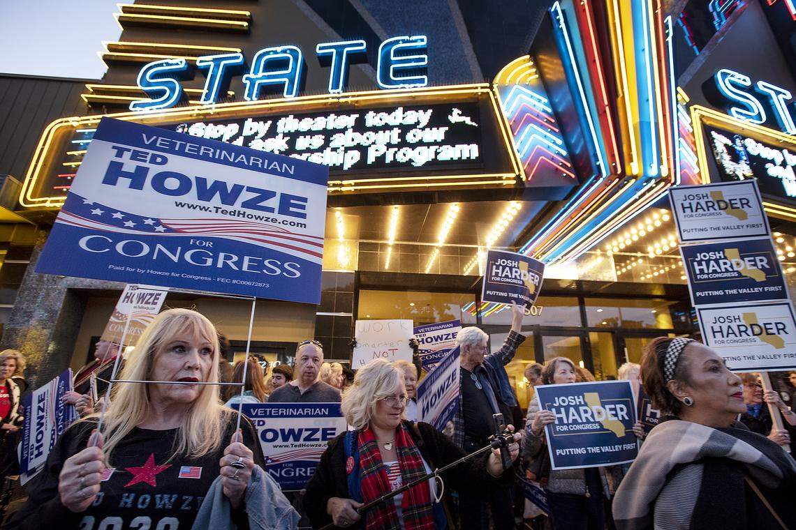 Ted Howze supporter Susan Dorrity of Modesto, left, and others wave signs for their candidates outside the State Theatre before the 10th Congressional District debate ÒDebate at the StateÓ in Modesto, Calif., on Wednesday, Jan. 22, 2020. 
