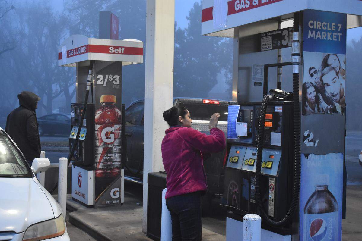Circle 7 gas station and convenience store manager Preet Kaur on Monday posts signs explaining the theft of customers’ data by credit card skimmers.