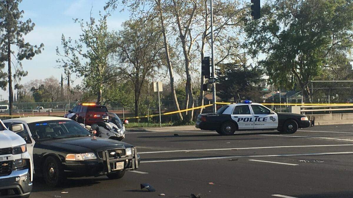 Police investigate an accident in this March file photo. Modesto is looking to cut 30 open police jobs to balance its budget.