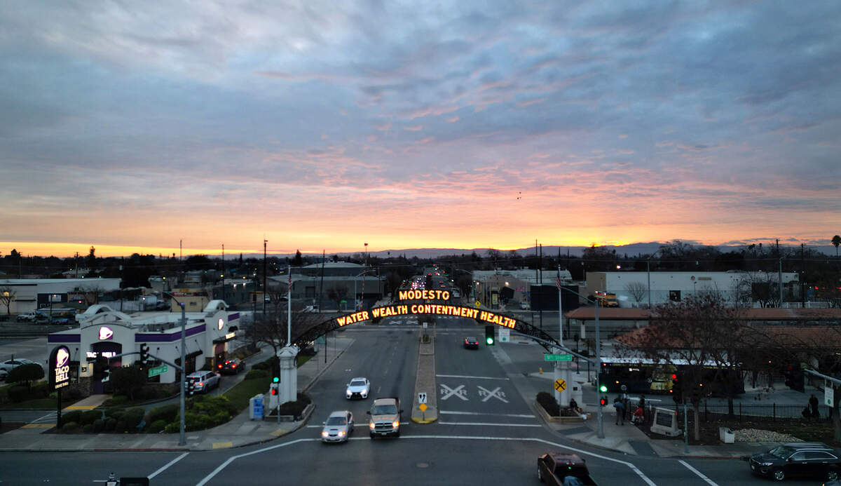 Looking over the Modesto arch as the sun sets behind the Diablo Range in January 2024.
