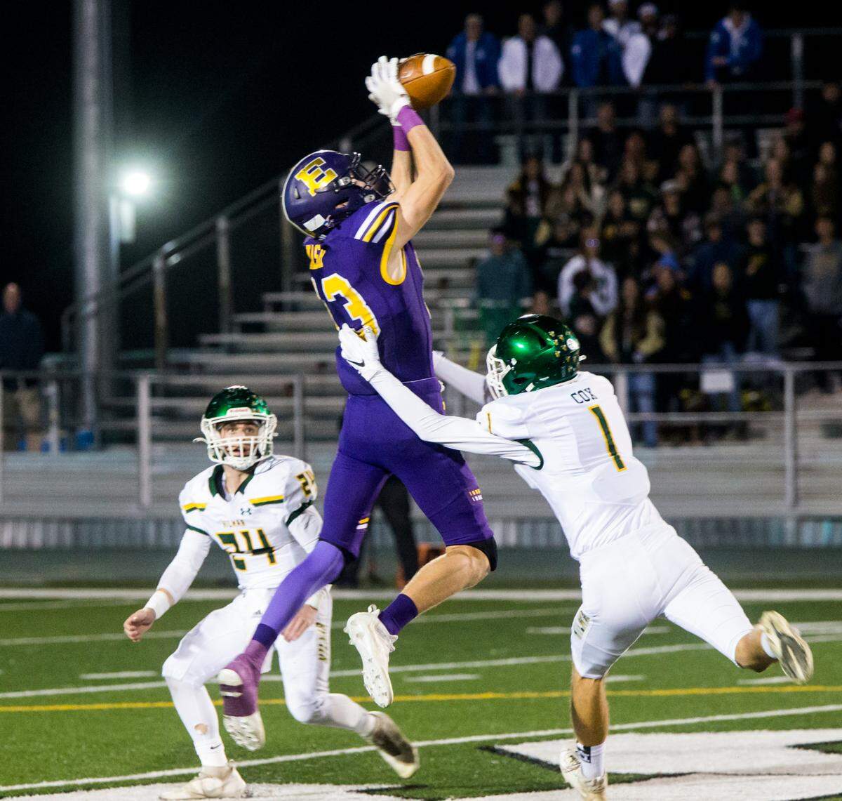 Escalon Highs Owen Nash, 13, jumps for a pass as Hilmar Highs Luke Cox, 1, and Jason Pimentel, 24, move in. Escalon High School took on Hilmar High football during the 2021 CIF Sac-Joaquin Football Playoffs - Division V at Saint Mary’s High School in Stockton, Ca. Escalon came out on top as the champions with a 20-13 win over Hilmar.