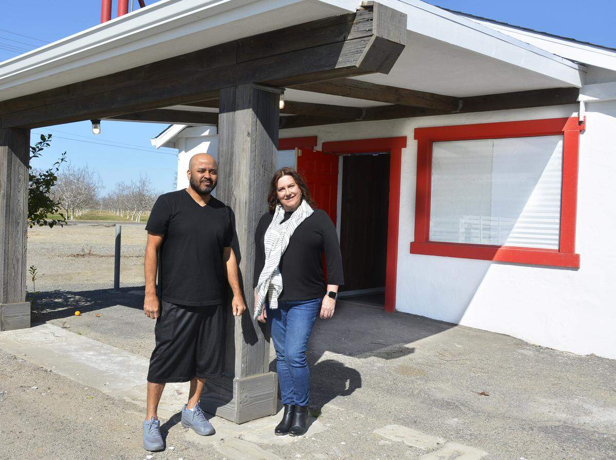William Ross (left) and Trace Tedde-Vega stand in front of Southern Magnolia Kitchen, a new restaurant in the old Farmer’s Catfish House space they are opening on Beckwith Road just west of Modesto, Calif. Feb. 29, 2020.