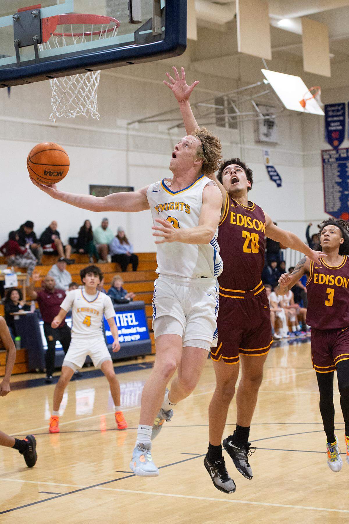 Ripon Christian’s Eli Terpsma scores on a layup past Edison’s Cruz Burrise during the Modesto Christian Holiday Hoop Classic game at Modesto Christian High School in Salida, Calif., Thursday, Dec. 29, 2022.