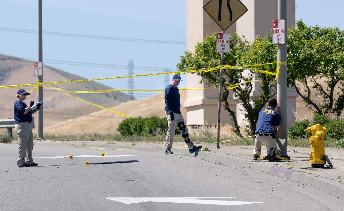 Members of the FBI evidence response team investigate an ICE shooting on Sperry Avenue in Patterson, Tuesday, April 7, 2026. 
