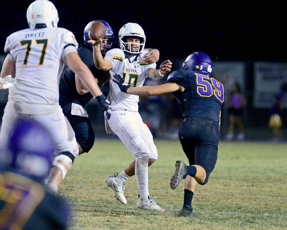 Hilmar quarterback Jorden Jacobo (10) gets sacked during the game with Escalon at Escalon High School on Sept. 26, 2025.
