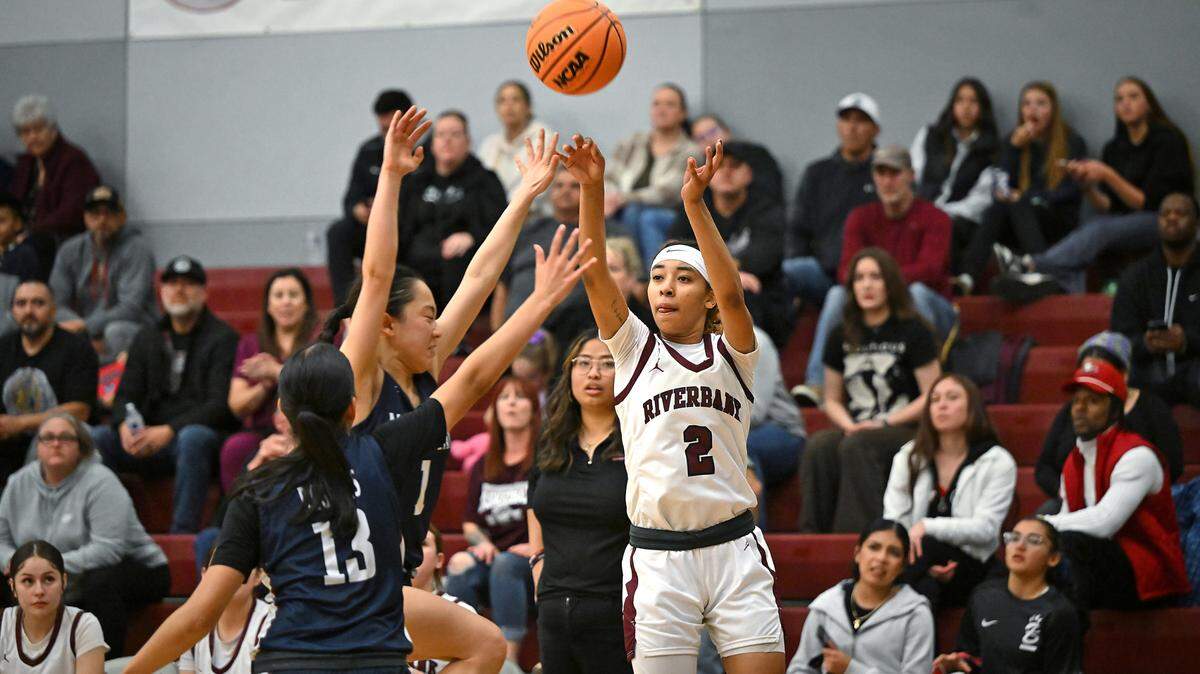 Riverbank’s Taylor Macias shoots from three point territory in the CIF Northern California Division IV playoff game with Notre Dame of San Jose at Riverbank High School in Riverbank, Calif., Thursday, Feb. 29, 2024.