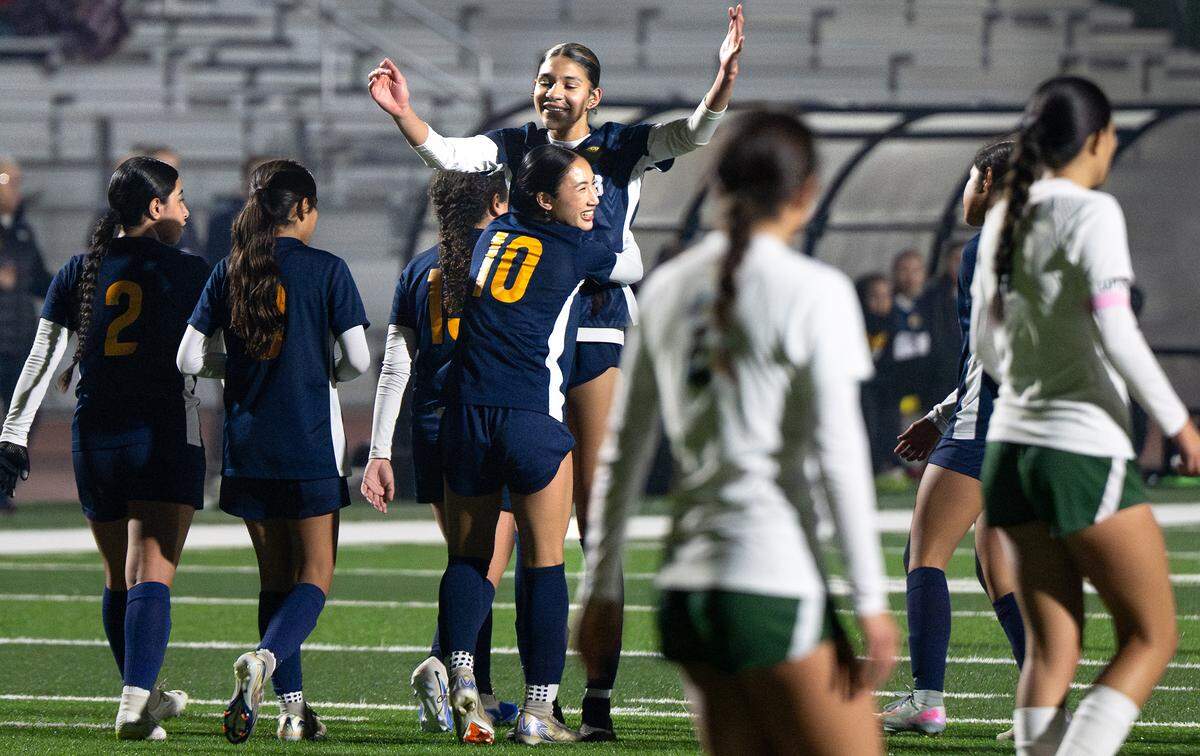 Gregori’s Grace Rodriguez (10) is greeted by teammate Kylie Farmer after scoring a goal during the Central California Athletic League game with Pitman at Gregori High School in Modesto on  Tuesday, Jan. 13, 2026.