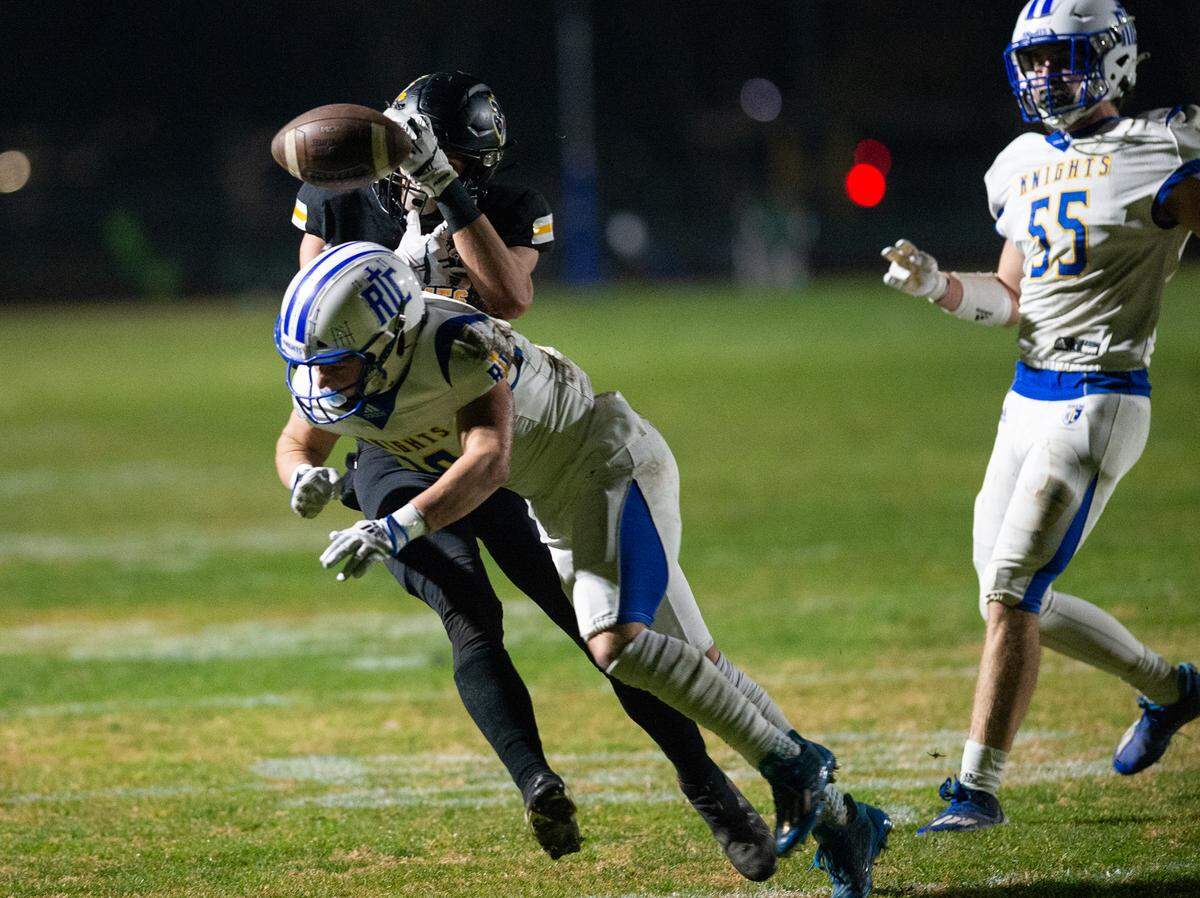 Ripon Christian’s Brady Grondz breaks up a pass intended for Hughson’s David Delgado during the CIF Division 5-AA Northern California Regional Bowl Game on Friday, Dec. 2, 2022, in Hughson, Calif.