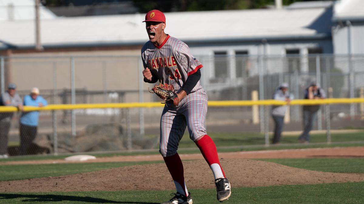 Oakdale pitcher Landon Schutte celebrates after an inning-ending strikeout during a Valley Oak League game against Central Catholic at Oakdale High School on Monday, April 13, 2026.