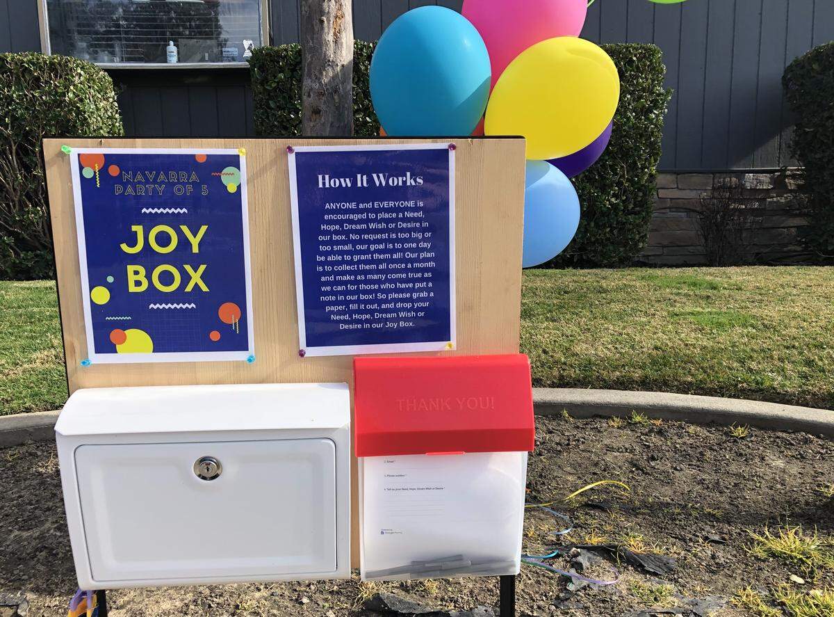 The Navarra family -- Dan and Amy and sons Levi, 6, and Davis and Lincoln, both 3 -- put the Joy Box in the yard of their Turlock home in January, asking people to submit their needs and wants.