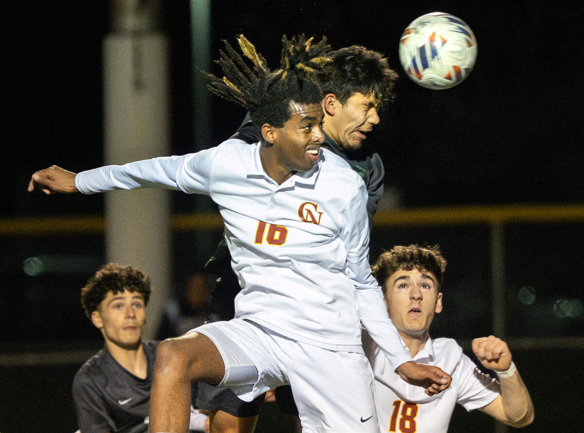 Pitman’s Davian Lizarraga beats Cardinal Newman’s Samuel Abbott (16) to the ball and scores a goal to tie the game with less than 2 minutes left in the CIF NorCal Division II regional semifinal playoff match at Turlock High School in Turlock, Thursday, March, 6, 2025. Cardinal Newman won the game in penalty kicks.