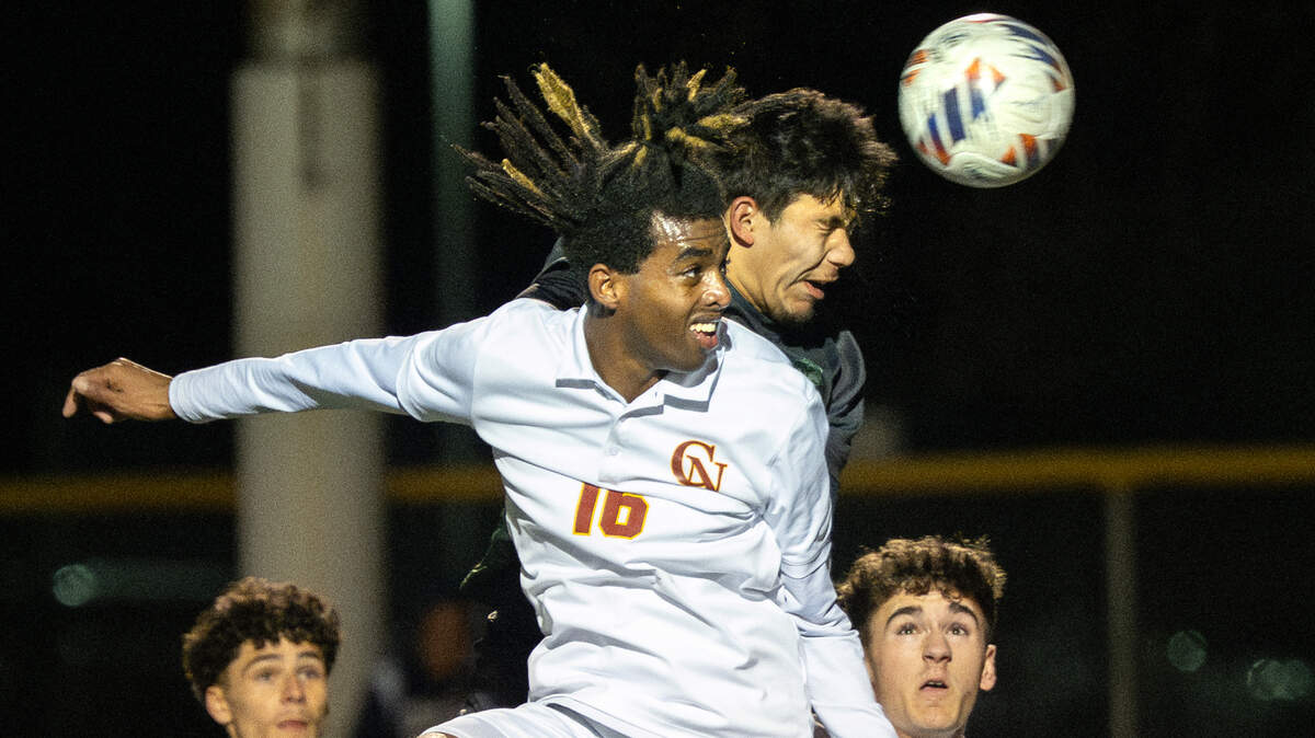 This is Andy Alfaro’s winning photo. Pitman’s Davian Lizarraga beats Cardinal Newman’s Samuel Abbott (16) to the ball and scores a goal to tie the game with less than 2 minutes left in the CIF NorCal Division II regional semifinal playoff match at Turlock High School in Turlock, Thursday, March, 6, 2025. Cardinal Newman won the game in penalty kicks.