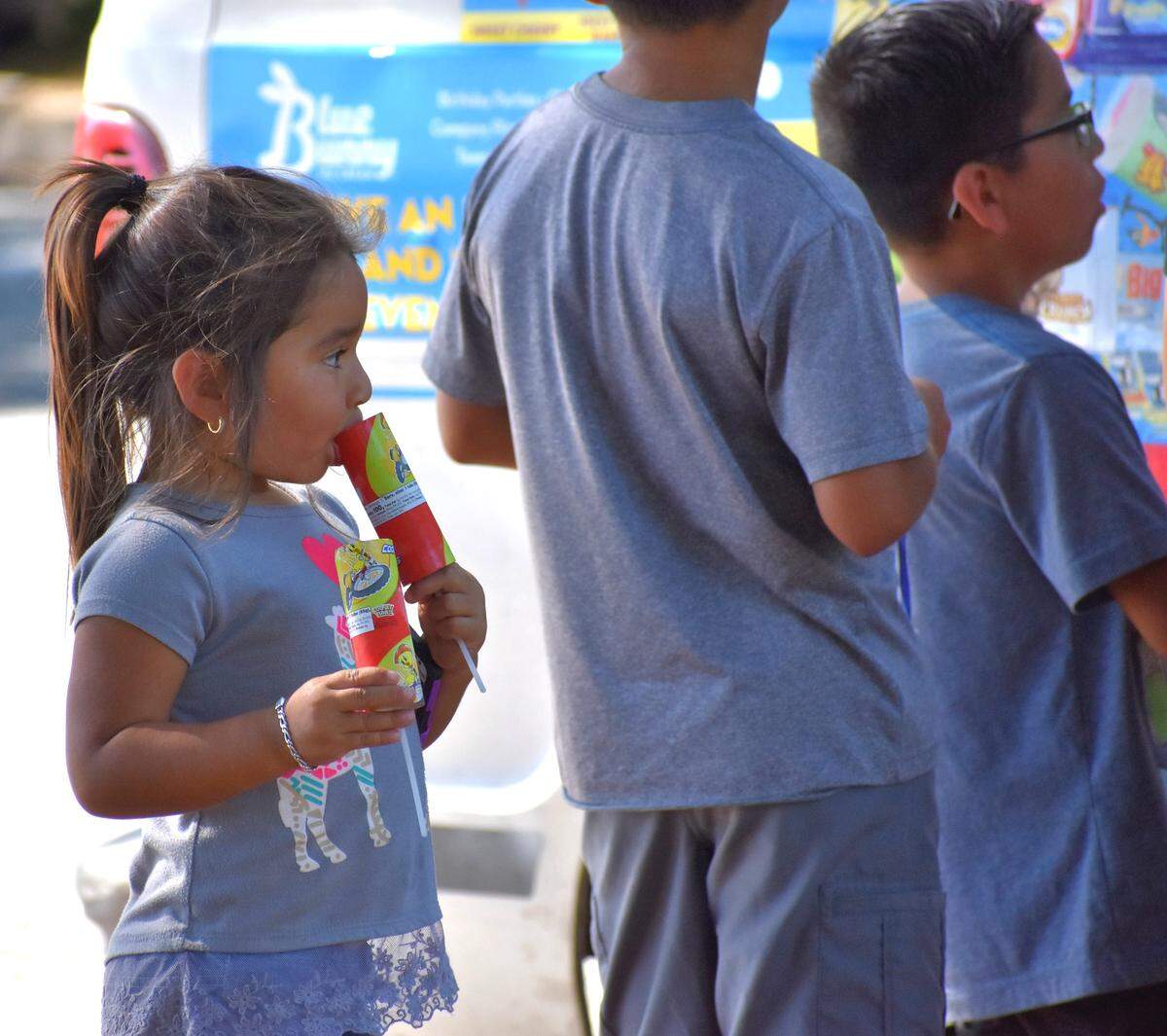 From a frozen-treat vendor on Rumble Road in Modesto on Sunday, July 14, 2019, 4-year-old Alexa Flores gets one for herself, one for a friend.