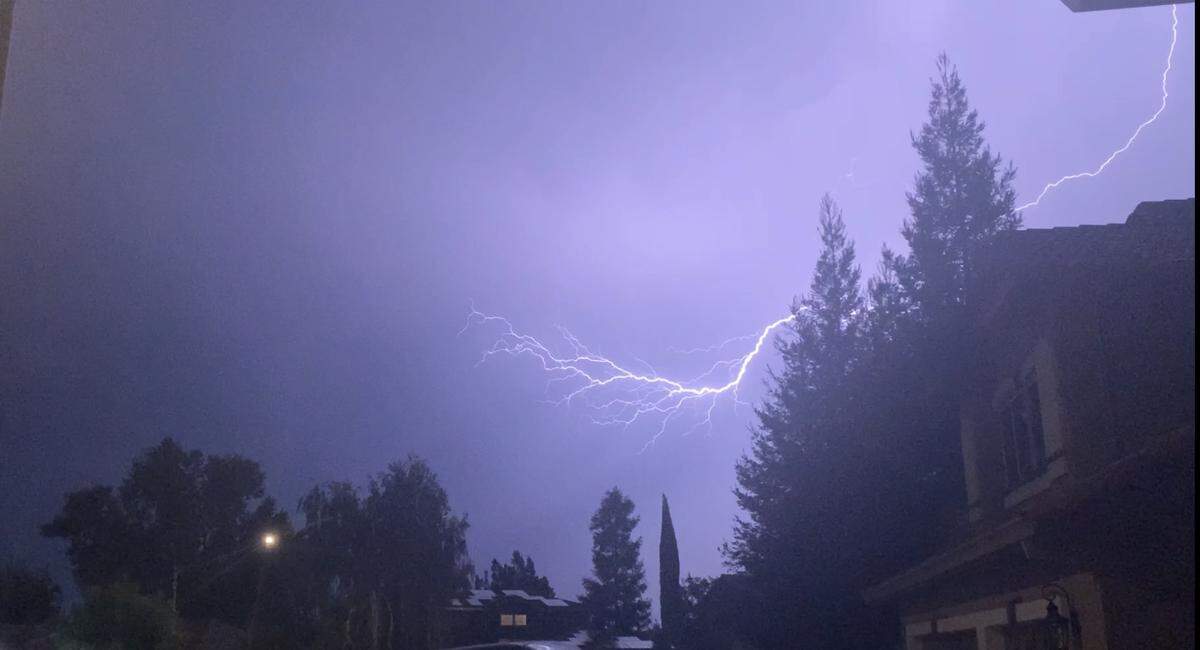 Lightning is visible in Oakdale during a storm on Sept. 9, 2021. Isolated thunderstorms are forecast for Northern California.