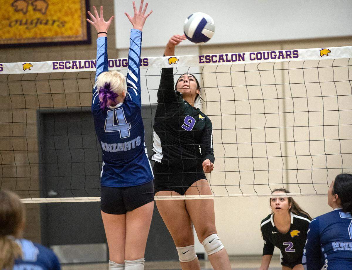 Escalon’s Lisa Murga drives the ball over the net past Downey’s Izzy Watson during a non-league match in Escalon, Calif., on Tuesday, September 27, 2022.