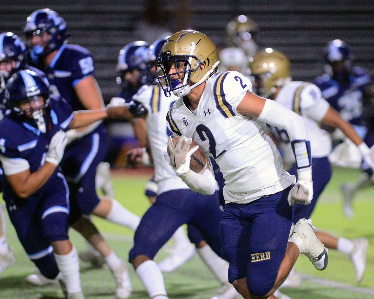 Elk Grove’s Polo Cooper (2) returns a kickoff for a touchdown during a game between Downey High School and Elk Grove High School at Downey High School in Modesto, Calif. on August 30, 2024.