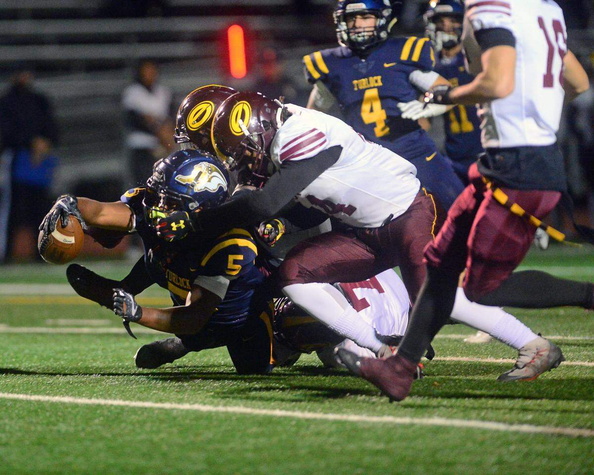 Turlock running back JT Foreman II (5) reaches out to score a touchdown during a CIF Division I CIF Sac-Joaquin Section Football Playoff game between Turlock High School and Edison High School at Turlock High School in Turlock CA on November 4, 2022. Turlock won 35-0.