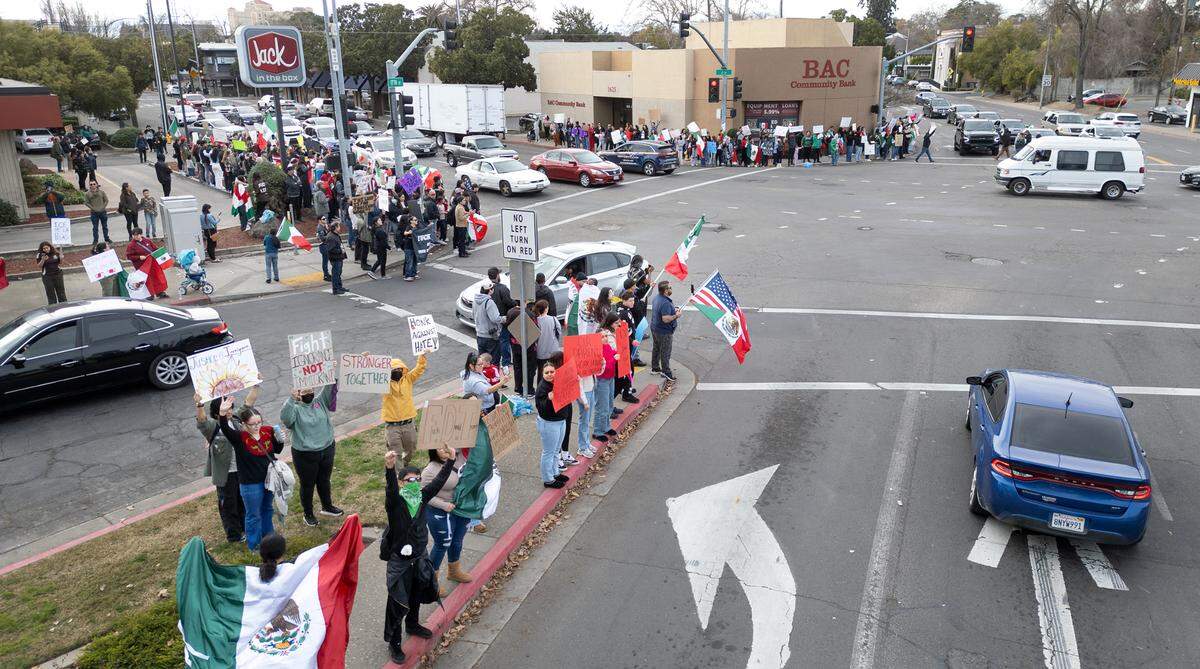 A few hundred people rallied at Five Points intersection to support immigrant rights in downtown Modesto, Monday, Feb. 3, 2025.