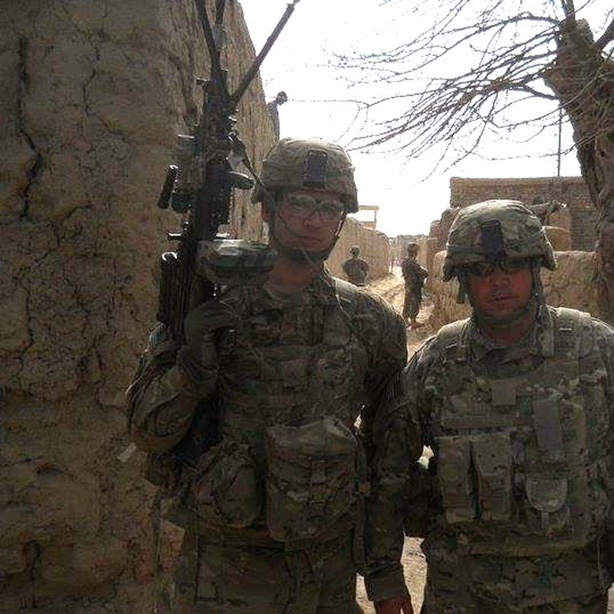 Eli Price, left, in an undated photo during his deployment in Afghanistan