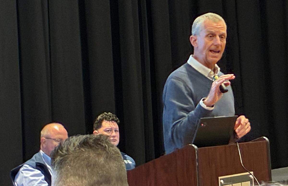 Art Thatcher from consulting firm BerryDunn is standing at a podium with his hand out for emphasis as he explains what residents can expect as part of the process for developing a master plan for Modesto City Parks