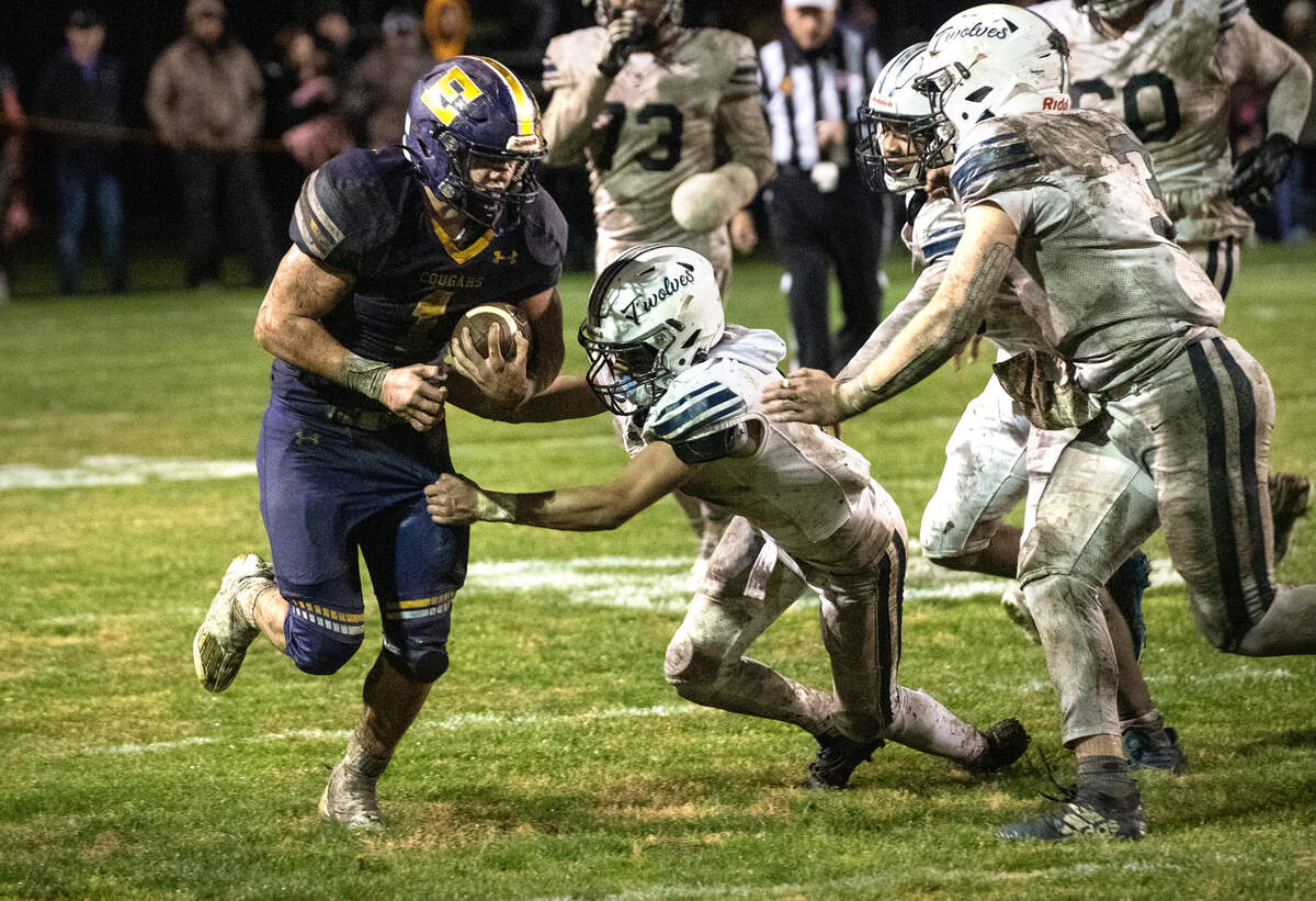 Escalon’s Ryker Peters runs the ball during the CIF State Division 4-AA Football Championship game with Northwood in Escalon, Calif., Saturday, Dec. 10, 2022.
