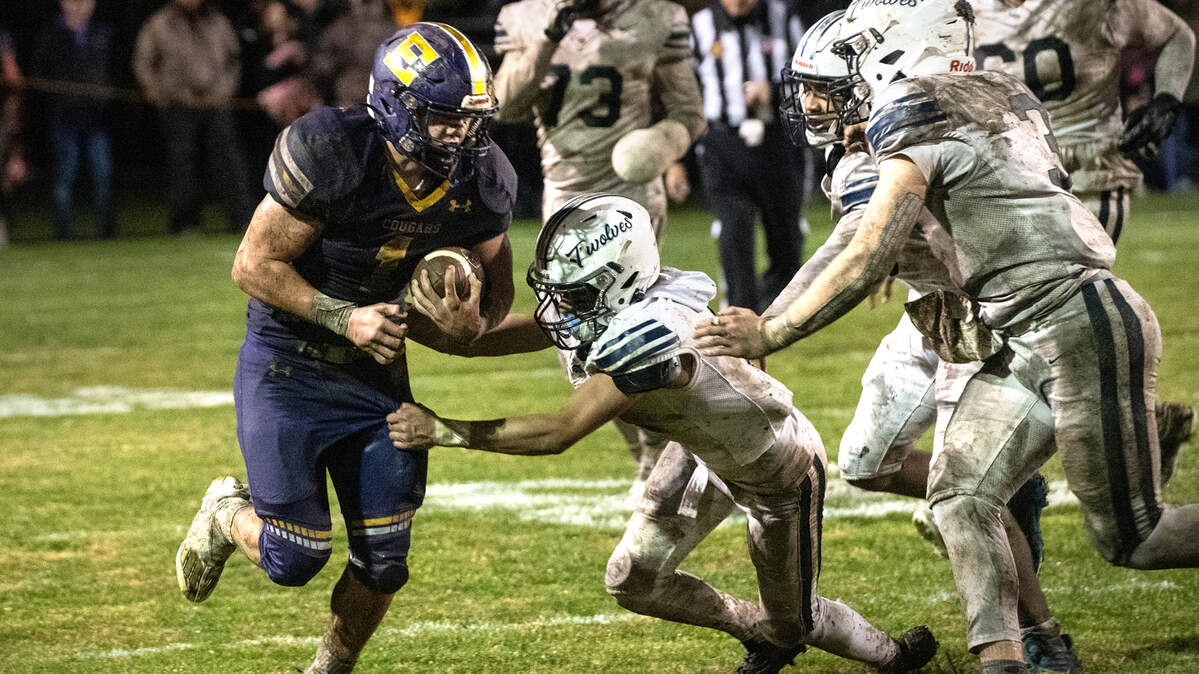 Escalon’s Ryker Peters runs the ball during the CIF State Division 4-AA Football Championship game with Northwood in Escalon, Calif., Saturday, Dec. 10, 2022.