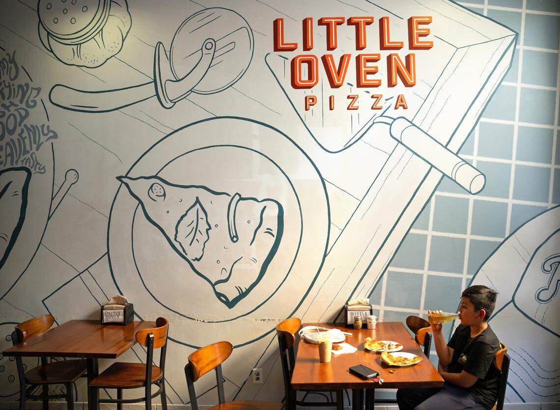 Eiyan Gonzalez, 10, enjoys a soda and a slice of pepperoni at Little Oven Pizza in Merced, Tuesday, March 25, 2025.