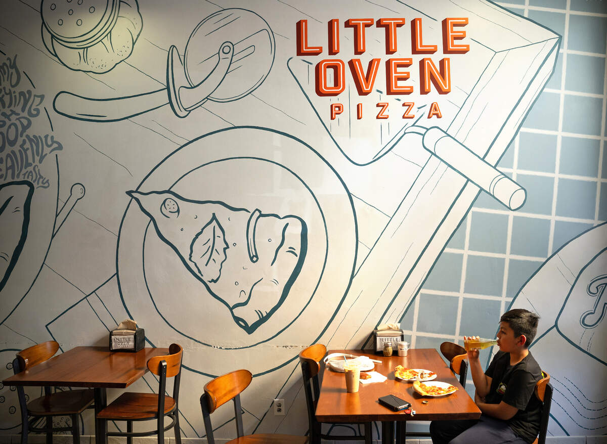 Eiyan Gonzalez, 10, enjoys a soda and a slice of pepperoni at Little Oven Pizza in Merced, Tuesday, March 25, 2025.