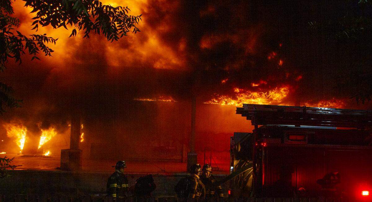 Modesto Fire Department crews battle a huge structure fire at a warehouse at the corner of Tully Road and Ninth Street on Sunday, July 7, 2019.