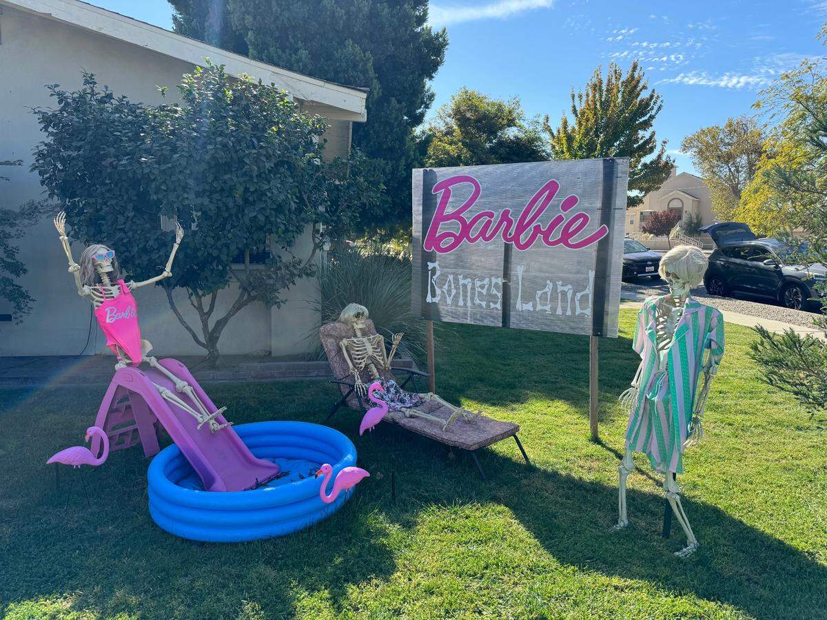 Skeleton Barbies take a dip on the side lawn of Rita and Jaci Machado’s house as part of their Halloween display on Thursday, Oct. 24 in Turlock.