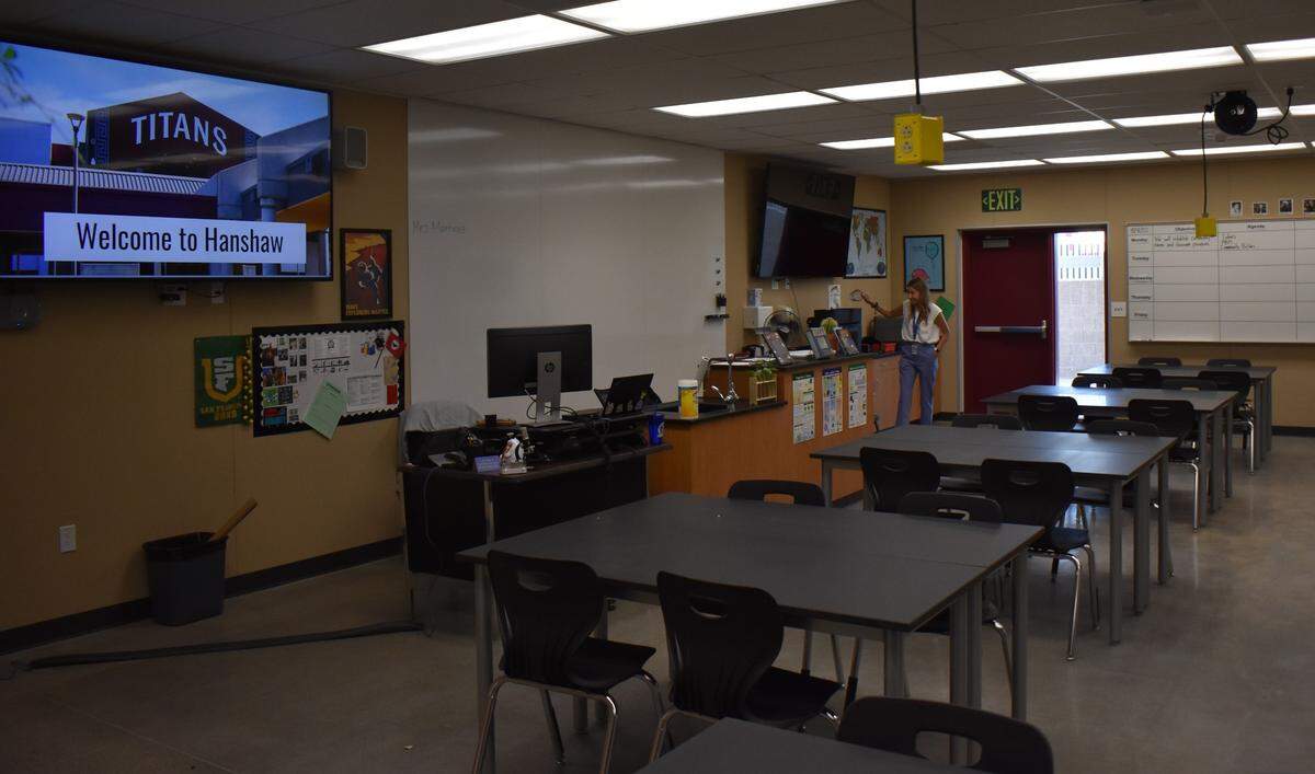 Gladys Martinez, a new teacher in a new science classroom at Hanshaw Middle School, prepares to welcome students on the first day of school for Modesto City Schools, Monday, Aug. 8, 2022.