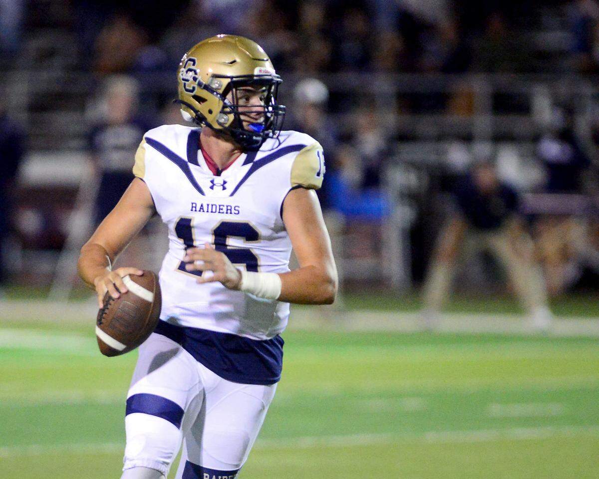 Central Catholic quarterback Kayden McHenry (16) scrambles out of the pocket during a game between Central Catholic High School and Patterson High School at Patterson High School in Patterson California on September 9, 2024. Central Catholic won the game 25-14