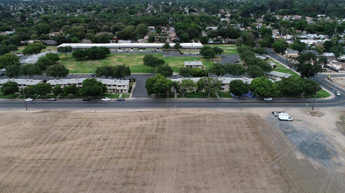 The empty lot on the south side of Robertson Road is a proposed site for Housing Authority apartment complex in Modesto, Calif., on Saturday, June 4, 2022.