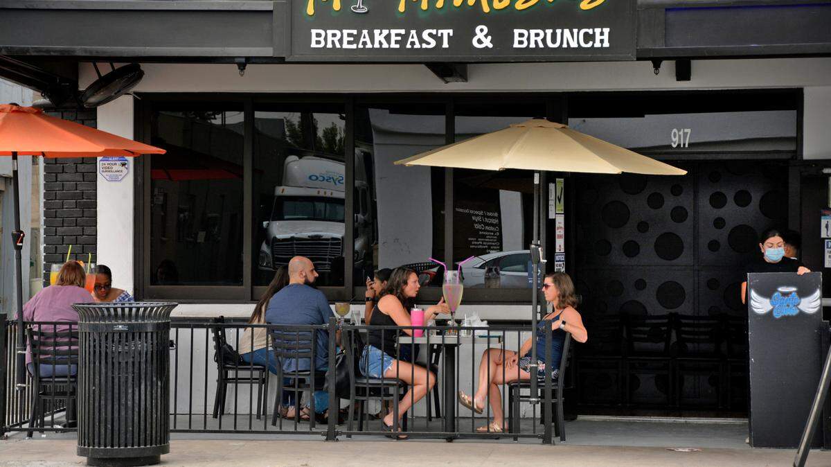 Diners on the patio at My Mimosas on J Street in downtown Modesto, Calif. Sept. 10, 2020.